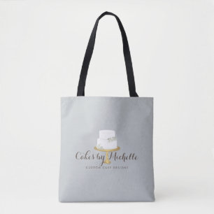 Elegante witte taart met bloemenbakkerij tote bag