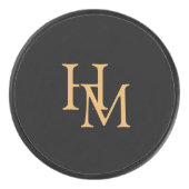 Elegante zwarte puck met gouden monogramlettering (Voorkant)