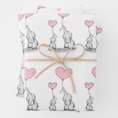 Elephant-familie met roze hartballonnen inpakpapier vel (In situ)