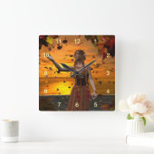 Elf in vallende bladeren tegen een herfstzonsonder vierkante klok (Huis)