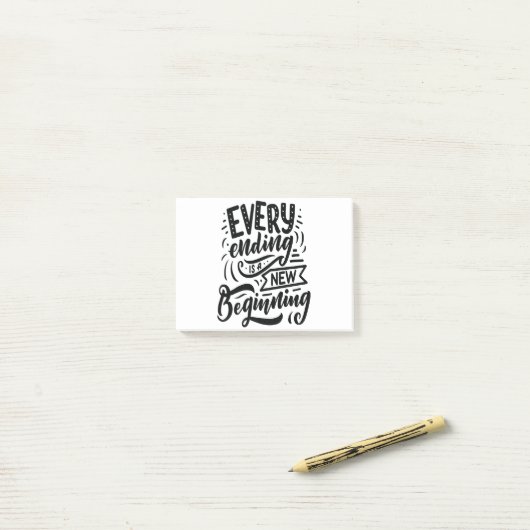 Elk einde is een nieuw begin post-it® notes (Op bureau)