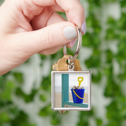 Emmer gevuld met zeemijlen sleutelhanger (Hand)