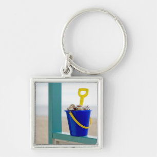 Emmer gevuld met zeemijlen sleutelhanger