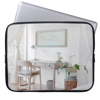 EMPTY DESK NEAR CURTATIE LAPTOP SLEEVE