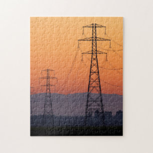 Energiemasten bij zonsondergang legpuzzel