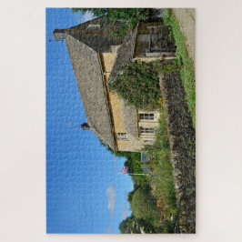 Engels huisje met tuin en vlag legpuzzel