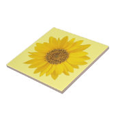 Enkelgele zonnebloem op lichtgeel tegeltje (Zijkant)