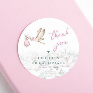 Er is een Village Stork Winter Girl Baby shower Ronde Sticker