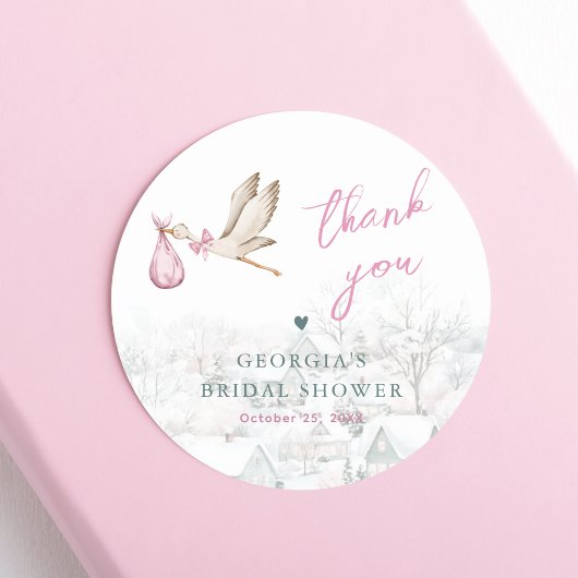 Er is een Village Stork Winter Girl Baby shower Ronde Sticker