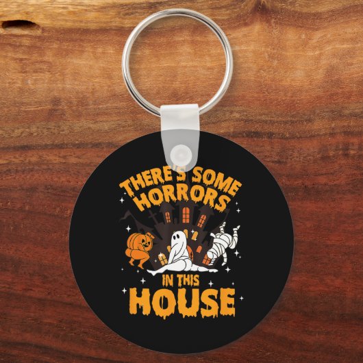Er zijn enkele verschrikkingen in dit huis pompoen sleutelhanger (Voorkant)