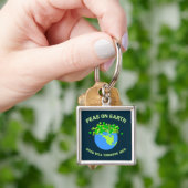 Erwten op aarde sleutelhanger (Hand)