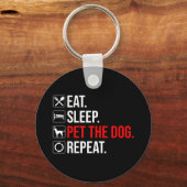 Eten. Slapen. De hond aaien. Herhalen Sleutelhanger (Achterkant)