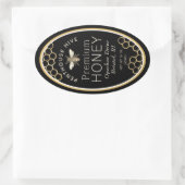 Etiket van ovale honing met honingraat en heraldis (Tas)