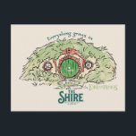 Everything Grows in THE SHIRE™ Briefkaart<br><div class="desc">Bring a little piece of Middle-Earth™ to your everyday with this charming Lord of the Rings™ design inspired by the cozy hills of Hobbiton. Featuring a storybook-style hobbit hole with its iconic round green door tucked into a lush hillside, the artwork is paired with the beloved phrase, “Everything grows in...</div>