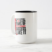 Evolutionair succes tweekleurige koffiemok (Voorkant links)