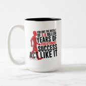 Evolutionair succes tweekleurige koffiemok (Links)