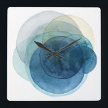 Evolving Planets - Waterverf cirkels Vierkante Klok<br><div class="desc">Evolving Planeten I door Grace Popp. Waterverf cirkels creëer planeet-achtige vormen die elkaar overlappen om prachtige variaties van blauw en blauwgroen te onthullen.</div>