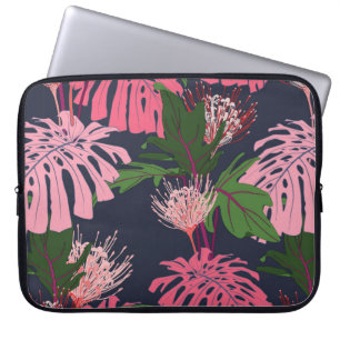 Exotische groene en roze tropische palmbladeren en laptop sleeve
