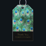 Exotische pauwenveren dank u cadeaulabel<br><div class="desc">Een gepersonaliseerd dank u geschenk label met een felgekleurd patroon van exotische en wilde pauwenveren in  blauwgroen,  juweelgroen,  aqua en kobaltblauw. Artistiek en fancy,  gemaakt met waterverven. Een chique en stijlvol design. Tekst is geschreven in een elegant gouden lettertype en zegt dank u met uw persoonlijke naam (en) hieronder.</div>