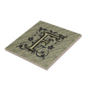 F -  monogram in reliëfdruk (goud) tegeltje (Zijkant)