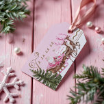 Fa La Merry Pink Christmas Santa Seligh Reindeer Cadeaulabel<br><div class="desc">Vier de magie van het seizoen met ons betoverende roze kerstmanrendier North Pole village vakantiegeschenk label. Dit prachtige label beschikt over een retro-stijl roze Kerstman in zijn charmante roze slee, sierlijk stijgende over een pittoreske Noordpool dorpje. De geïnspireerde "Fa la" groet brengt een vleugje nostalgische elegantie, het toevoegen van een...</div>