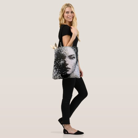 Fading grayscale pixel portrait with emotion tote bag (Op model)