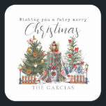 Fairy Merry Christmas Woodland Forest Vierkante Sticker<br><div class="desc">Illustratie van een boomstronk feeënhuis versierd voor Kerstmis met twee bomen,  kerstverlichting en lantaarn. Tekst zegt,  "Wishing you a fairy merry Christmas" Personaliseer met naam.</div>