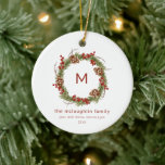 Familienaam Initiaal Christmas Greenery Keramisch Ornament<br><div class="desc">Een elegant kerst groen familie initiaal ornament. Dit kerstboom ornament. beschikt over een groene krans met dennenappels en bessen en een initiaal in het midden van de krans. Alle tekst op de kaart kan worden aangepast aan creëer de perfecte familie kerstboom keepsake ornament.</div>