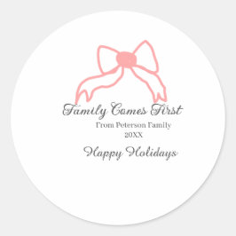 Family comes first red bow family name holidays ronde sticker