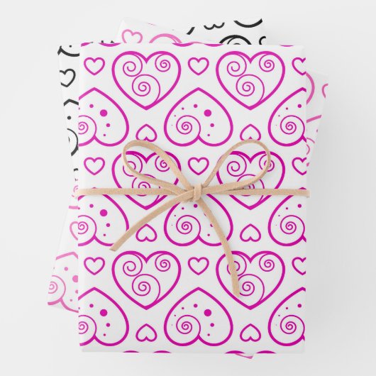 Fantastisch zwarte en roze harten die papierbladen inpakpapier vel (In situ)
