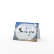 Fat Clouds Over Beach Foto w / Badge Dank u