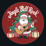 Father Christmas Jingle Bell Rock Ronde Sticker<br><div class="desc">Dit leuke ontwerp van Father Christmas die gitaar speelt in de buurt van een kerstboom met het bochtige tekst gezegde "Jingle Bell Rock" is ideaal voor een kerstcadeau.</div>