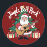 Father Christmas Jingle Bell Rock Ronde Sticker<br><div class="desc">Dit leuke ontwerp van Father Christmas die gitaar speelt in de buurt van een kerstboom met het bochtige tekst gezegde "Jingle Bell Rock" is ideaal voor een kerstcadeau.</div>