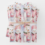 Feestelijk gejuich met lachende sneeuwpoppen en sn inpakpapier vel (In situ)