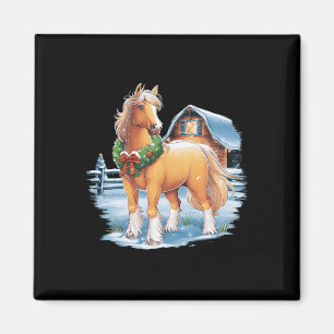 Feestelijk paard met krans in besneeuwde achtertui magneet