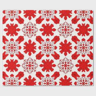Feestelijk patroon van rode en witte sneeuwvlokken cadeaupapier