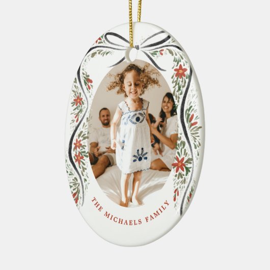 Feestelijk zwart lint met poinsettia's en groen keramisch ornament (Links)