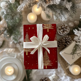 Feestelijke gouden kerstbomen op rood cadeaupapier