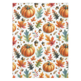 Feestelijke herfstpompoenen en bladeren op wit tafelkleed
