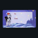 Feestelijke Husky Christmas Gift Labels<br><div class="desc">Animal Parade Feestelijke Husky Dog Christmas Gift To/From Labels bevat onze originele kunst van een schattige zwart-witte Siberische Husky uitgedost voor de feestdagen met een felrode kerstmuts. Onze leuke zwart-witte hond staat in een besneeuwd landschap met een gestructureerde sterrenblauwe nachtelijke hemel geschilderd door Traci Van Wagoner. Deze leuke huisdierkunst is...</div>