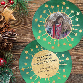 Feestelijke kerststerren: groen en goud feestdagenkaart