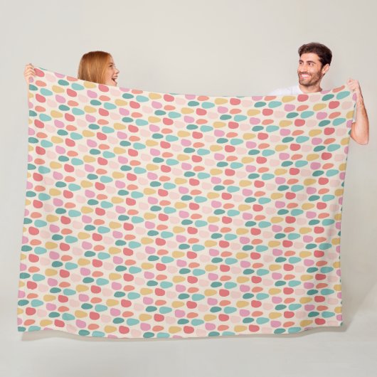 Feestelijke pasteldruppelpatroon fleece deken (In situ)
