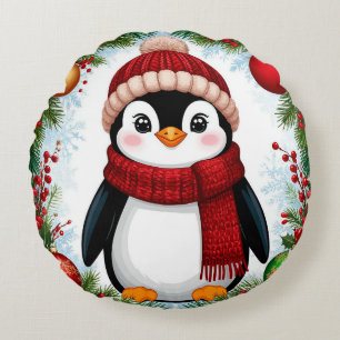 Feestelijke pinguïn versierd met kerstornamenten rond kussen
