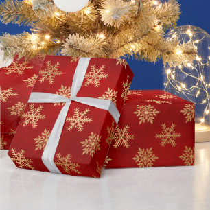 Feestelijke rode en gouden folie wintervlokken cadeaupapier