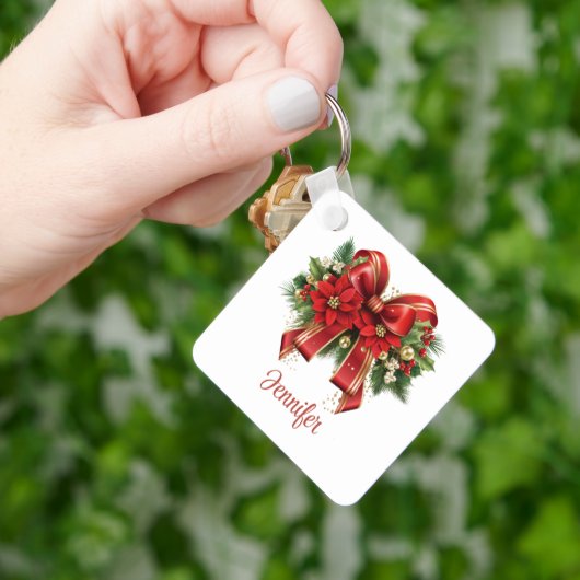 Feestelijke rode en gouden kerstboog sleutelhanger (Hand)