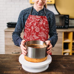 Feestelijke rode kardinaal vogel, pijnboom en wint schort