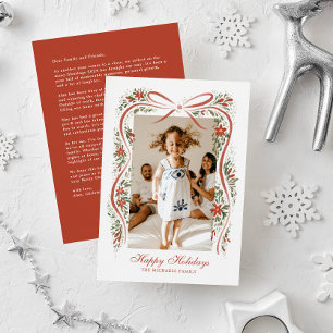 Feestelijke rode lint met poinsettia's en groen feestdagenkaart