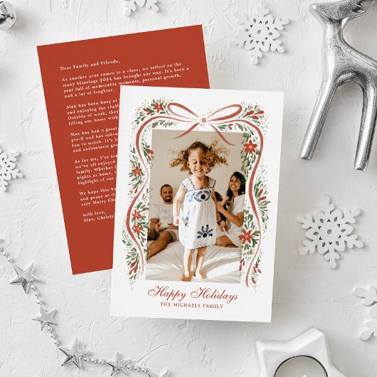 Feestelijke rode lint met poinsettia's en groen feestdagenkaart