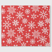 Feestelijke sneeuwvlok patroon op rode achtergrond cadeaupapier (Vlak)