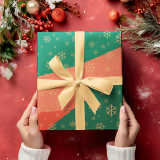 Feestelijke sneeuwvlokken op rood en groen inpakpa cadeaupapier
